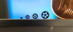 Gears created using 3D printing for micro molding. Euro shown for comparison.